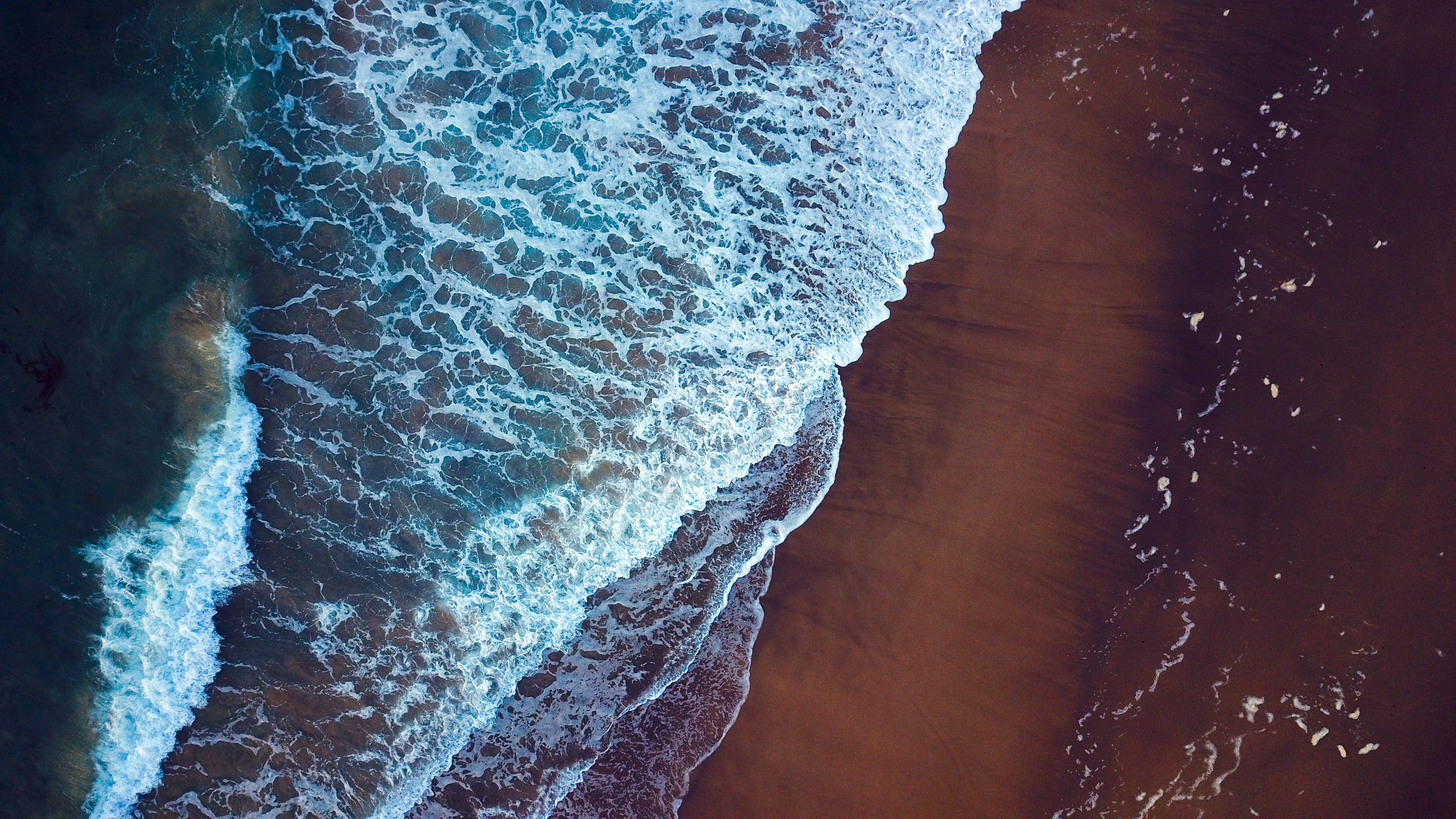 aerial view of sea waves during daytime